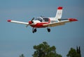 Sport airplane soaring in sky