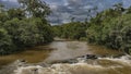 The Iguazu River flows in the jungle between banks Royalty Free Stock Photo