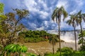 Iguazy Falls panorama view from the jungles with palms and cloud