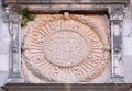 IHS sign on church facade in Dubrovnik