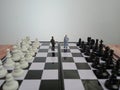 Iillustration for photo War, battle or politic situation concept, 2 standing mini figure, negoitation or debate beyond chess