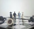 Iillustration for photo War, battle or politic situation concept, 2 standing mini figure, negoitation or debate beyond chess