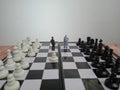 Iillustration for photo War, battle or politic situation concept, 2 standing mini figure, negoitation or debate beyond chess