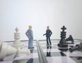 Iillustration for photo War, battle or politic situation concept, 2 standing mini figure, negoitation or debate beyond chess