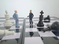 Iillustration for photo War, battle or politic situation concept, 2 standing mini figure, negoitation or debate beyond chess