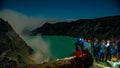 Ijen crater night view. the tourists passing by watching the phenomenon of blue fire.