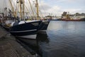 a fishing trawler at the docks of the harbor of Ijmuiden