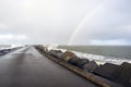 Ijmuiden pier with rainbow in the Netherlands Royalty Free Stock Photo