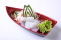Ika (squid) Sashimi in wooden boat dish isolated on white backgr Royalty Free Stock Photo