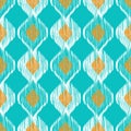 Ikat ethnic seamless pattern in blue and yellow colors