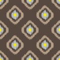 Ikat geometric seamless pattern. Yellow and brown collection.