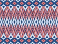Ikat pattern as ethnic fabric in diamond and rectangle design. Wallpaper seamless pattern design in blue and rose color. Royalty Free Stock Photo
