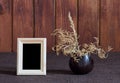 Ikebana and photo frame Royalty Free Stock Photo