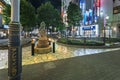 Public monument shaped in treble clef in the Sunshine Street at night.