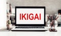 IKIGAI text on laptop screen on office desk background. Japanese concept