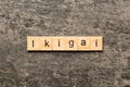 ikigai word written on wood block. ikigai text on table, concept Royalty Free Stock Photo