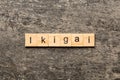 ikigai word written on wood block. ikigai text on table, concept