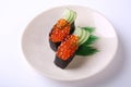 Ikura Nigiri Sushi, Salmon Roe with sushi rice and seaweed on wh