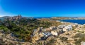 Il-Mellieha, Malta - Beautiful panoramic skyline view of Mellieha town on a bright summer day with Paris Church, Agatha Red Tower Royalty Free Stock Photo