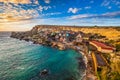 Il-Mellieha, Malta - Sunset at the famous Popeye Village at Anchor Bay Royalty Free Stock Photo