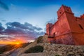 Il-Mellieha, Malta - Tourists watching sunset at St Agatha`s Red Tower Royalty Free Stock Photo