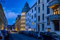 Ila school in Oslo Norway at evening with cars parked in front