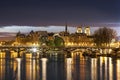 Ile de la citÃÂ© and pont des arts with cathedral in Paris by night - France Royalty Free Stock Photo