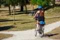 Fit woman riding bicycle in park Royalty Free Stock Photo