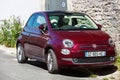 Red Fiat 500 Hatchback car parked on street Royalty Free Stock Photo