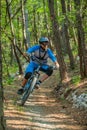 ILIRSKA BISTRICA, SLOVENIA - Sep 12, 2019: Cyclist riding mountain bike in forest
