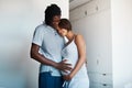 Ill always be there for the both of them. happy young man posing with his pregnant wife at home. Royalty Free Stock Photo