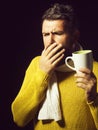 Ill bearded man with flu and fever drinking healing tea. Unwell man coughing. Treatment and healthcare. Handsome guy Royalty Free Stock Photo