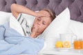 Ill boy suffering from cough in bed Royalty Free Stock Photo