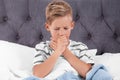 Ill boy suffering from cough in bed Royalty Free Stock Photo
