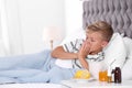 Ill boy suffering from cough in bed Royalty Free Stock Photo