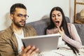 Ill couple having medical teleconsultation using digital tablet at home Royalty Free Stock Photo