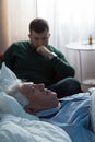 Ill father lying in hospital bed Royalty Free Stock Photo