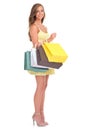 Ill find any sale. Studio shot of a young woman carrying a bunch of shopping bags. Royalty Free Stock Photo