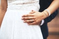 Ill always hold you dear my love. an unrecognizable newlywed couple holding hands on their wedding day. Royalty Free Stock Photo