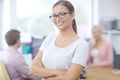 Ill lead this team to success. Portrait of an attractive young brunette businesswoman with her colleagues in the Royalty Free Stock Photo