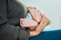 Ill love you forever, thats a promise. Closeup shot of a woman holding up her babys tiny feet. Royalty Free Stock Photo