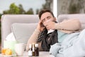 Ill man suffering from cough on sofa Royalty Free Stock Photo