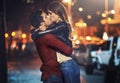 Ill never let you go. a young couple sharing a romantic kiss together outside at night. Royalty Free Stock Photo