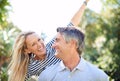 Ill never stop appreciating you. a handsome mature man piggybacking his wife in the park. Royalty Free Stock Photo