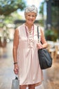 Ill never stop shopping. Cropped portrait of a senior woman out on a shopping spree. Royalty Free Stock Photo