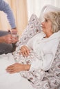 Ill older woman in bed Royalty Free Stock Photo