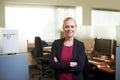 Ill play hard when the works done. Portrait of an attractive businesswoman standing with her arms crossed in the office. Royalty Free Stock Photo