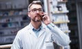 Ill prepare your medication for collection. a mature pharmacist talking on a cellphone in a pharmacy.