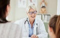 Ill treat you with a smile. a mature female doctor talking to a patient at a hospital. Royalty Free Stock Photo