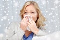 Ill woman blowing nose to paper napkin Royalty Free Stock Photo